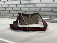 a guccissi bag on a counter top